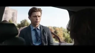 young man in suit smiling in car — Spiderman: No Way Home