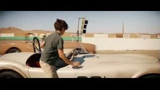 man and boy in vintage race car — Ford v Ferrari