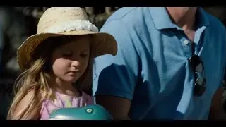 man and girl with toy dinosaur at exhibit — Jurassic World