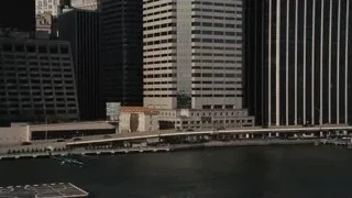 Helicopter flying over bridge in city — Succession