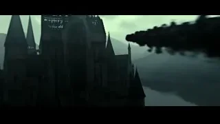 dragon flying over castle on cliff — Harry Potter and the Deathly Hallows 2
