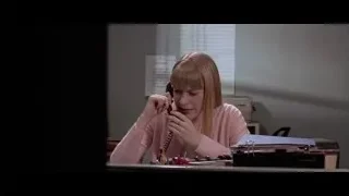 Man talking on phone in booth — American Psycho