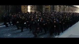 police officers in riot gear running at night — Batman: The Dark Knight Rises