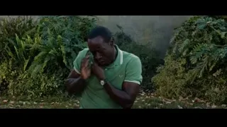 man kneeling in garden with fallen leaves — Iron Man 3