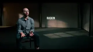 Aza Raskin sitting in dark room with spotlight — The Social Dilemma