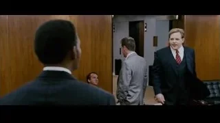Two men in suits conversing in hallway — The Persuit of Happyness