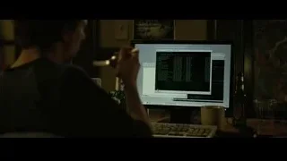 person working on computer at desk — The Social Network