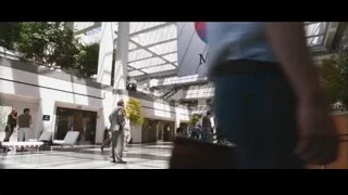 people walking in modern Macintosh building — Jobs
