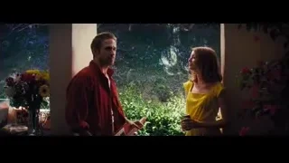 man and woman conversing by window — La La Land