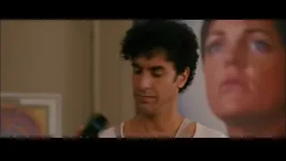 man in tank top talking on phone — The Dictator