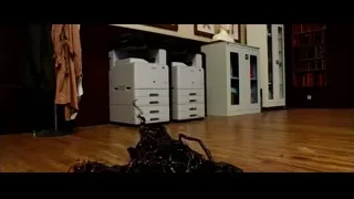 room with large tangled black sculpture — Lucy