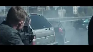 man with gun by SUV on foggy street — Deadpool