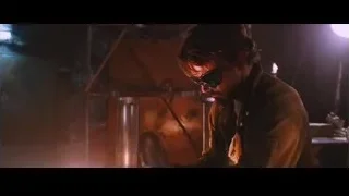 man working in dimly lit workshop — Iron Man