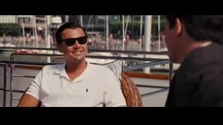 two men conversing on boat — The Wolf Of Wall Street