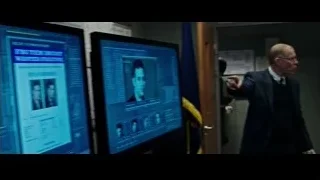 office with monitors showing FBI information — Now You See Me 2