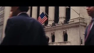 Men walking past government building with flags — The Wolf Of Wall Street