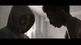 two men in dimly lit room — Southpaw