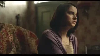young woman sitting on couch in dimly lit room — Peaky Blinders