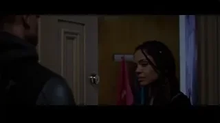 man and woman looking at each other by door — Creed