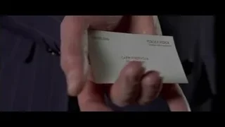 Hand holding "Pierce & Pierce" business card — American Psycho