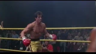 man boxing in ring with red gloves — Rocky III