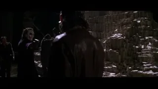 Joker holding gun in dark alleyway — Batman: The Dark Knight