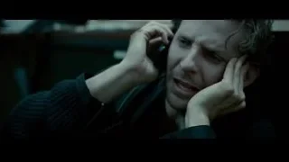 man holding phone to ear in dark room — Limitless