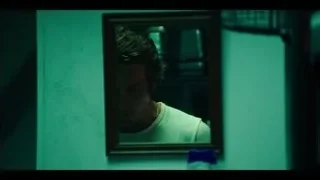 young man looking at himself in mirror — The Bear
