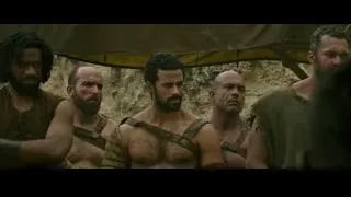 Group of men in Roman attire in rocky desert — Gladiator 2