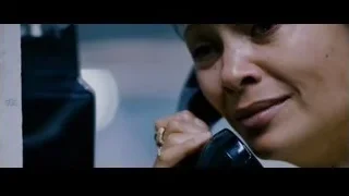 woman holding phone to ear with serious expression — The Persuit of Happyness