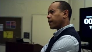 Students listening to speaker in lecture hall — Suits