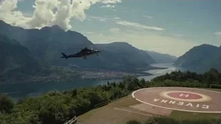 helicopter flying over lake and mountains — Succession