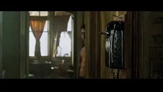 man standing in dimly lit room with vintage phone — Fight Club