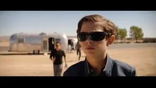 Young boy in desert by airstream trailer — Ford v Ferrari