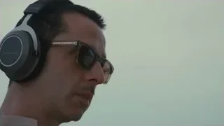 Man wearing headphones and sunglasses — Succession
