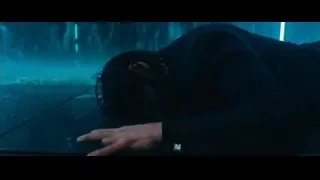 man standing in rain with neon lights — John Wick: Chapter 4