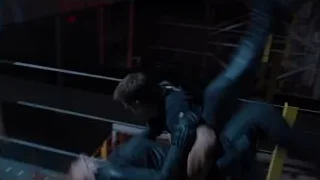 man and woman embracing in dark room — The Avengers