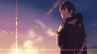 Young man looking at sunset with rainbow — Your Name