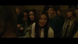 Young woman smiling in lecture hall — The Social Network
