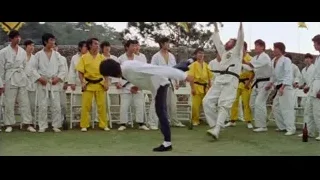 men practicing martial arts kicking in courtyard — Bruce Lee: Enter The Dragon