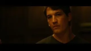 young man in dark t-shirt in dimly lit room — Whiplash