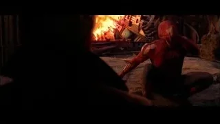 Spider-Man sitting in front of raging fire — Spider Man 2