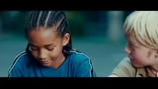 Two children conversing on outdoor bench — The Karate Kid