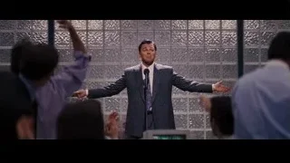 Man giving speech on stage to audience — The Wolf Of Wall Street