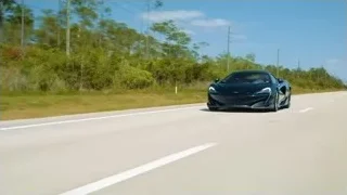 Black sports car driving fast — Sports Cars