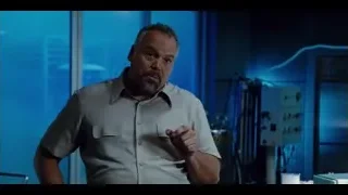 man explaining in laboratory with blue walls — Jurassic World