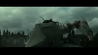 Large white dragon on city rooftop — Harry Potter and the Deathly Hallows 2