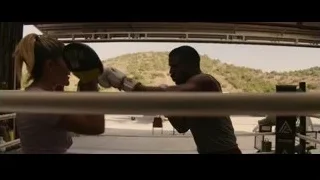 Man and woman sparring in boxing ring — Creed 3