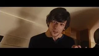 Man with beard speaking in a room — Now You See Me