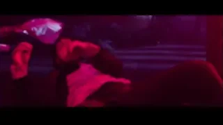 people dancing on stage with lights — John Wick
